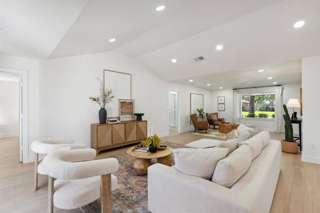 This perspective showcases the seamless flow of the open-concept living area, offering easy access to the surrounding spaces of the home.