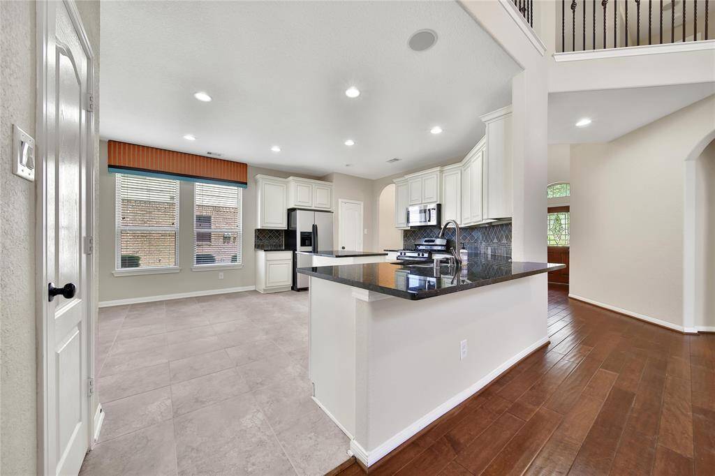 Two island in the kitchen. A central island plus extended peninsula perfect for entertaining.
