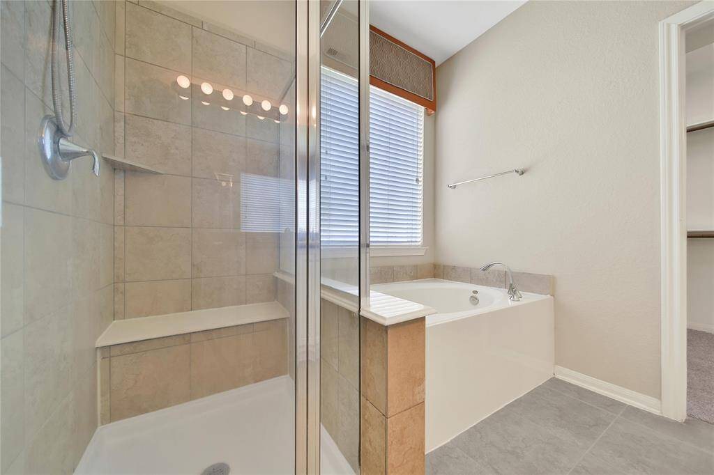Separate and walk in shower in the primary bathroom.