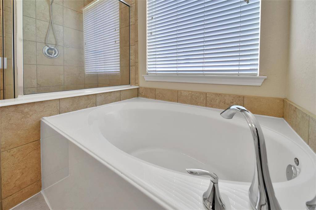 Separate tub in the primary bathroom.