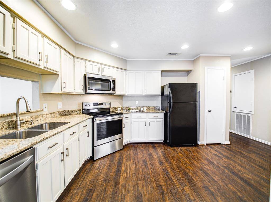 Enjoy daily joy in a well-designed kitchen with sleek granite countertops and a smart, functional layout.