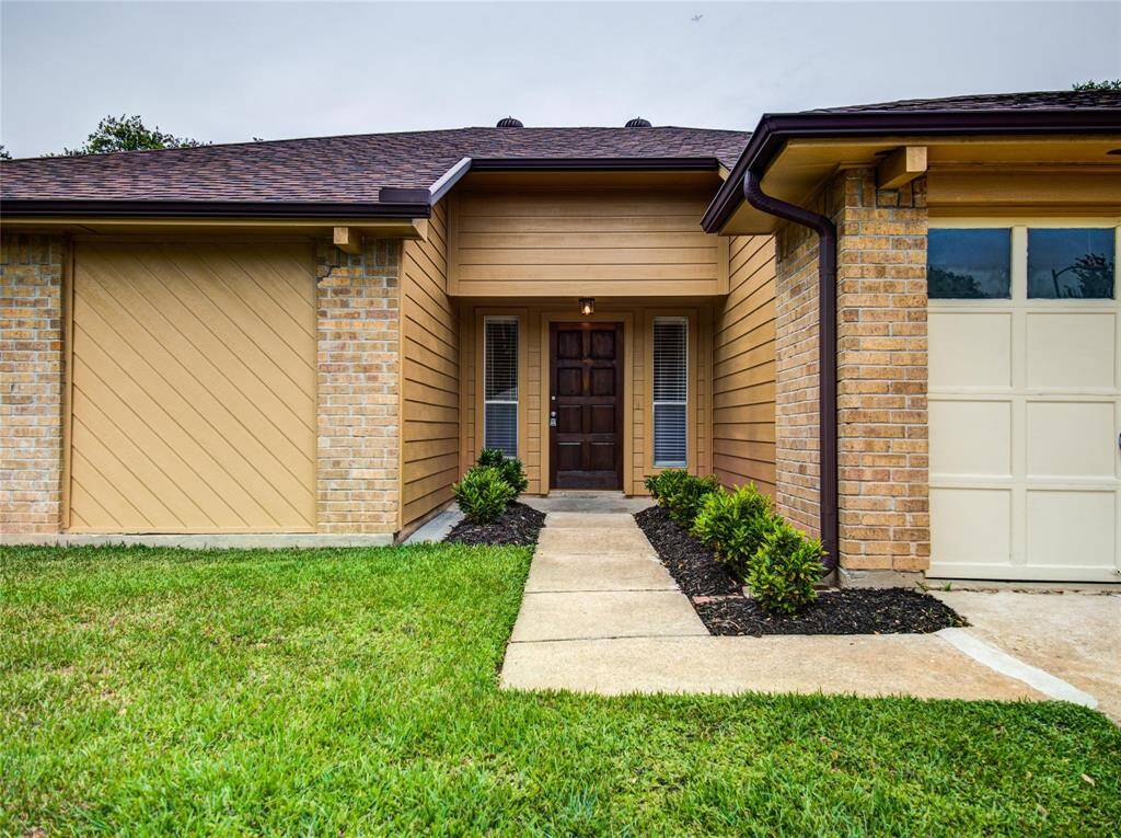 House Entrance with staged Landscaping.