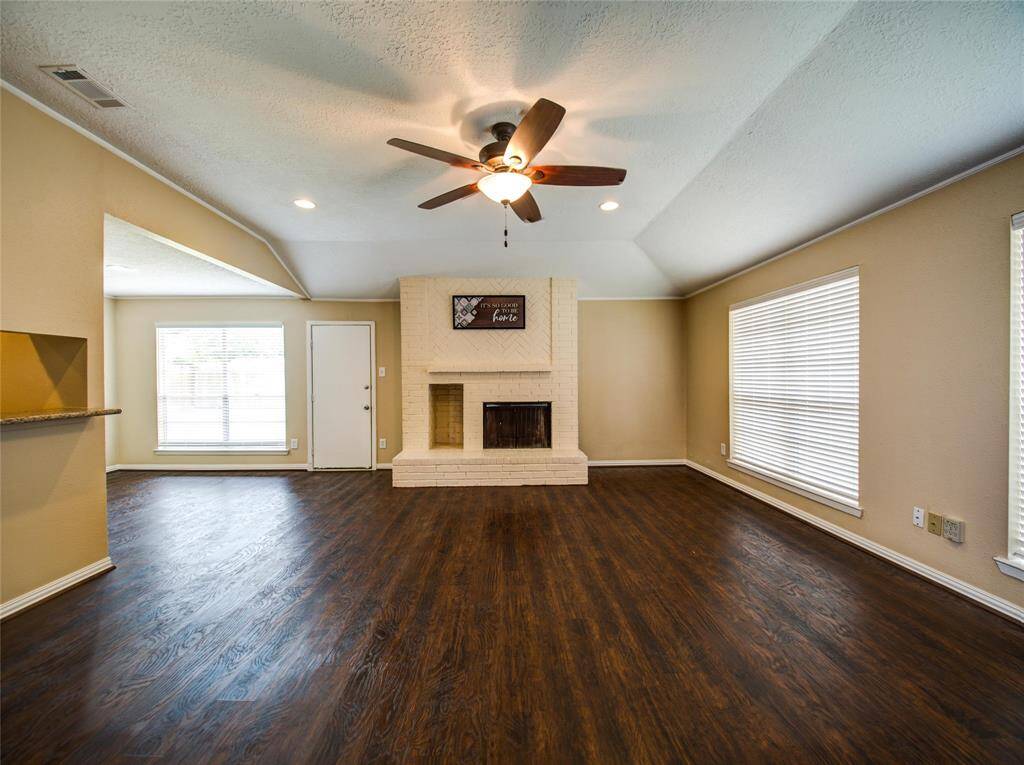 Bright  living room with large windows and abundant natural light.