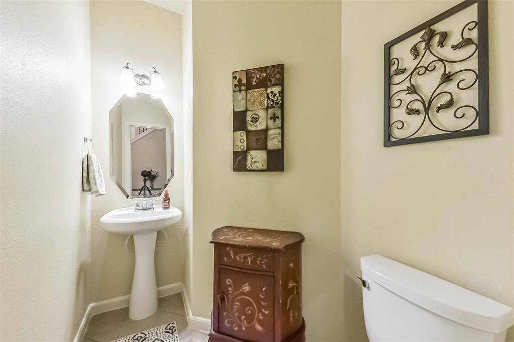 Half-bathroom downstairs is roomy and offers your guest privacy.