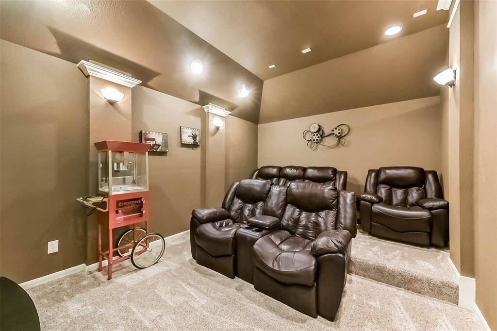Go to the movies without leaving your home! This home theater features raisers for the theater experience and dimmable lighting.