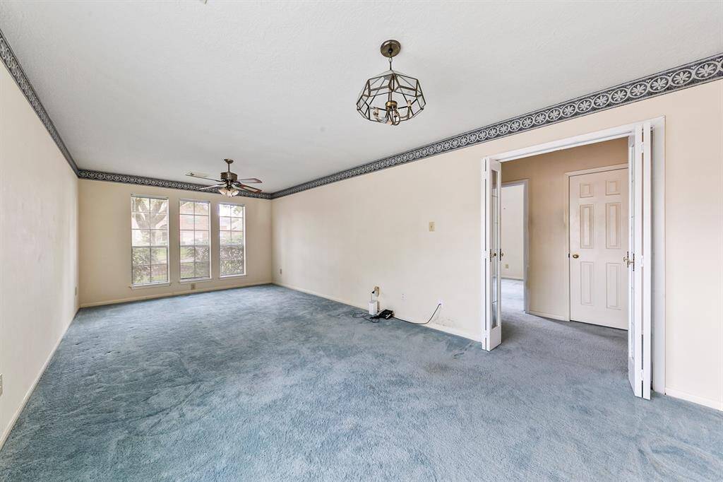 The front of the home features a spacious formal living/dining room. Previous photos from 2022 Prior to freeze