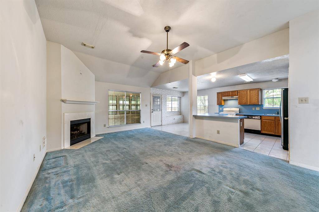 The living room features a cozy fireplace. Previous photos from 2022 Prior to freeze