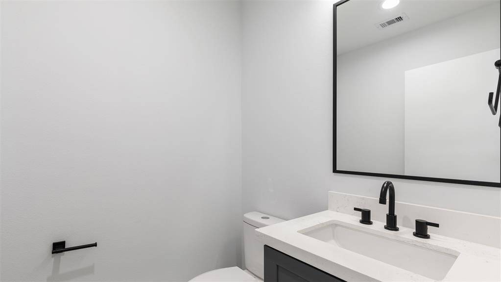 Half bathroom with modern features.