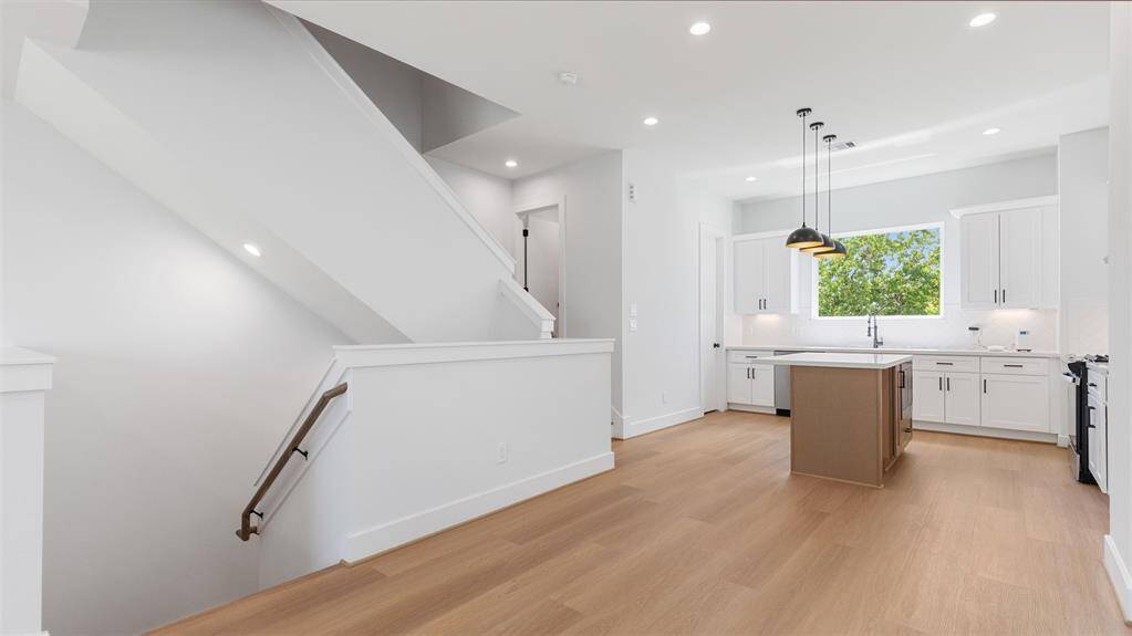 Another view of the bright andspacious living room.