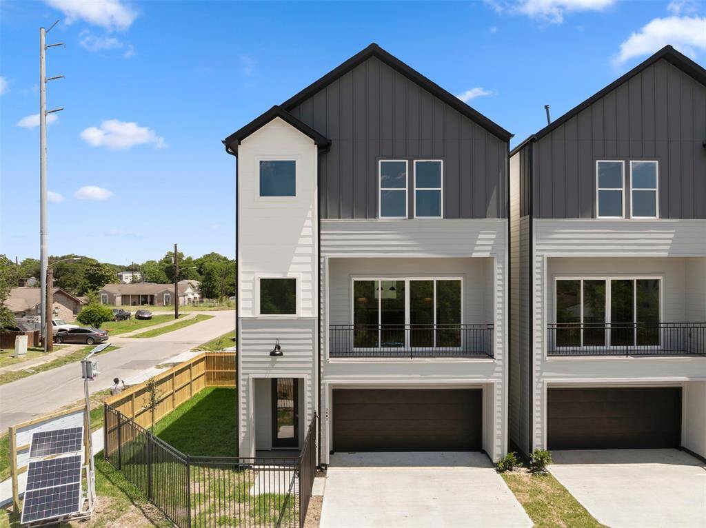 This home has an attached garage and outdoor balcony!