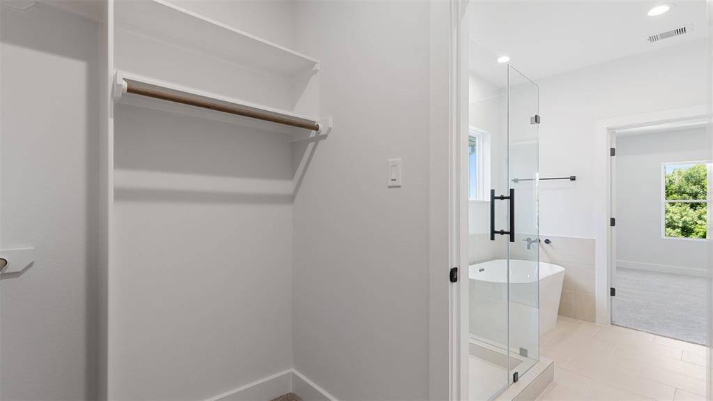 The primary bathroom also has a spacious closet.