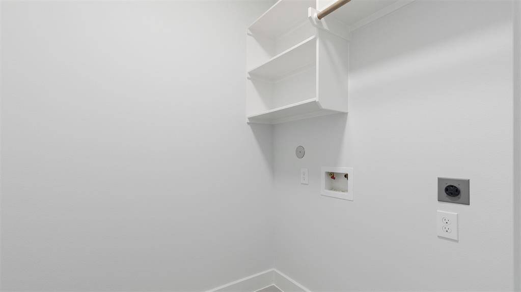 The laundry room features washer and dryer connections, andplenty of storage space.