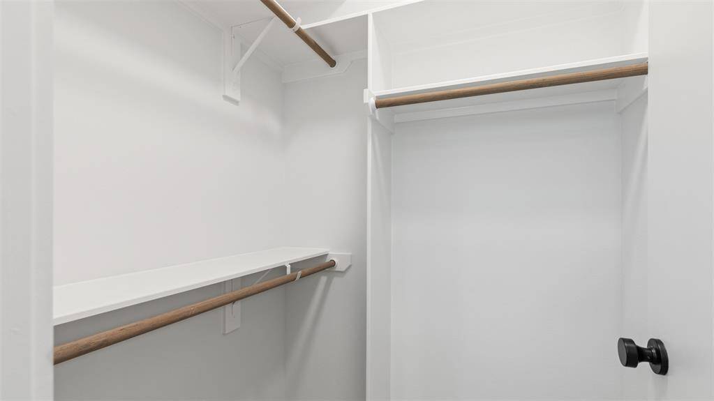 The first floor walk-in closet features plenty of storage space.