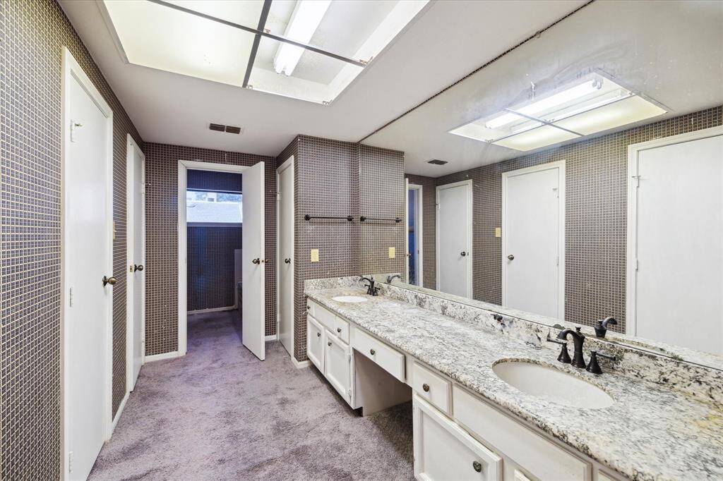 Primary bathroom with separate shower and tub, large closet, separate water closet that is waiting for your redesign.