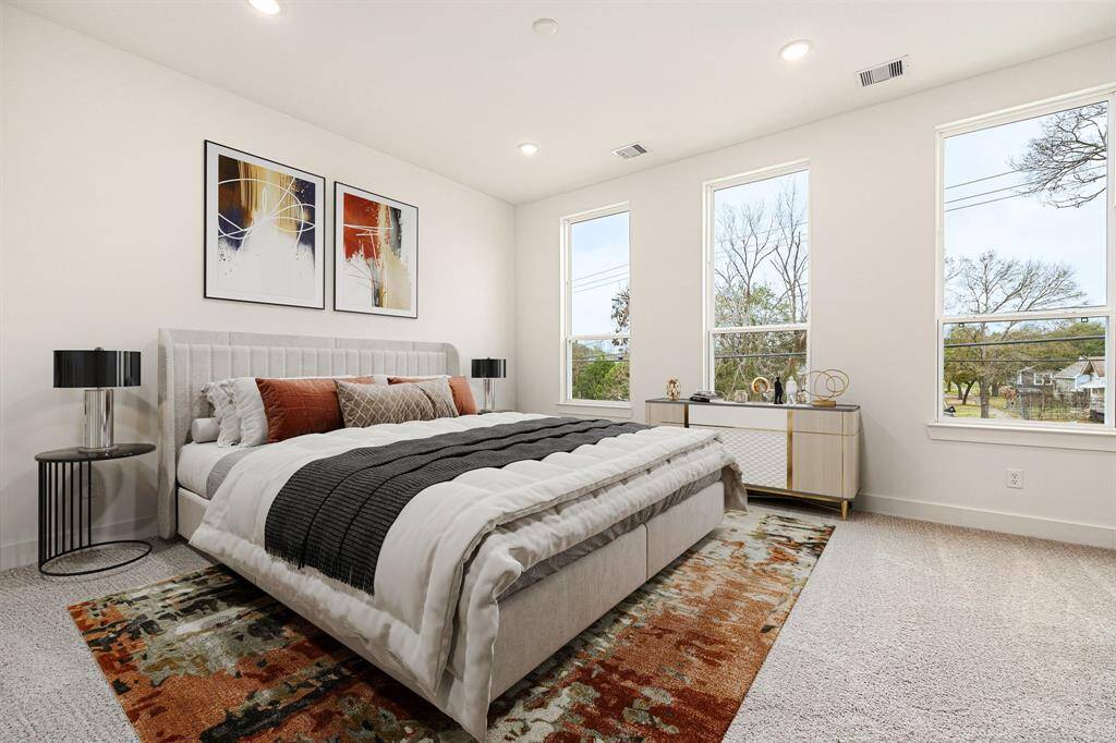 Welcome to your serene retreat! This luxurious primary suite welcomes you with plush carpeting, soaring ceilings, and oversized windows that bathe the space in natural light. The expansive layout offers plenty of room for a cozy seating area, creating the perfect spot to unwind. Elegant and inviting, this stunning bedroom is designed for ultimate comfort and relaxation—a true sanctuary to come home to!