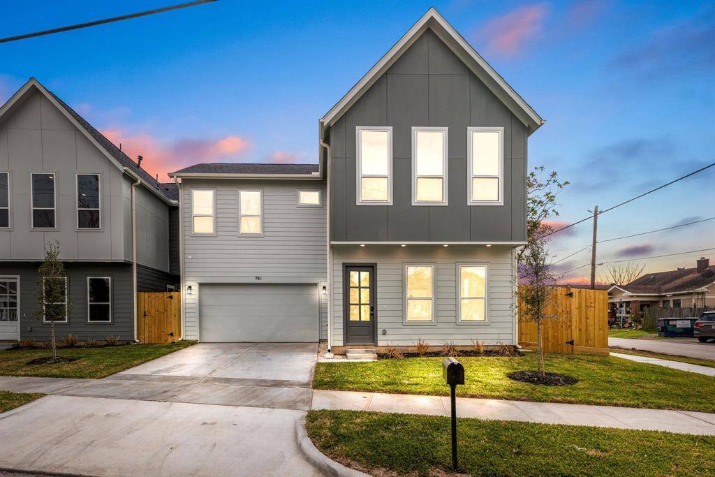 Welcome to 751 Dumble Street, a modern masterpiece nestled on a quiet corner lot in Houston’s dynamic EaDo District—just minutes from Downtown! This stunning home boasts exceptional curb appeal, a sleek contemporary design, and a private double-wide driveway. The inviting entryway, featuring an elegant glass-detailed front door, sets the tone for the stylish interiors within. Enjoy a beautifully designed, low-maintenance lawn, perfect for effortless living.