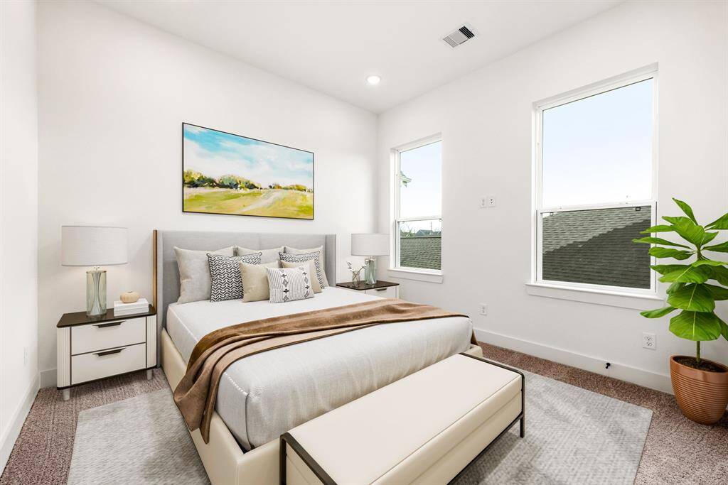 This inviting secondary bedroom offers plush carpeting for ultimate comfort, recessed lighting for a warm ambiance, and expansive windows that frame breathtaking views of the downtown skyline. A perfect blend of style and serenity, this space is ideal for relaxation or productivity.
