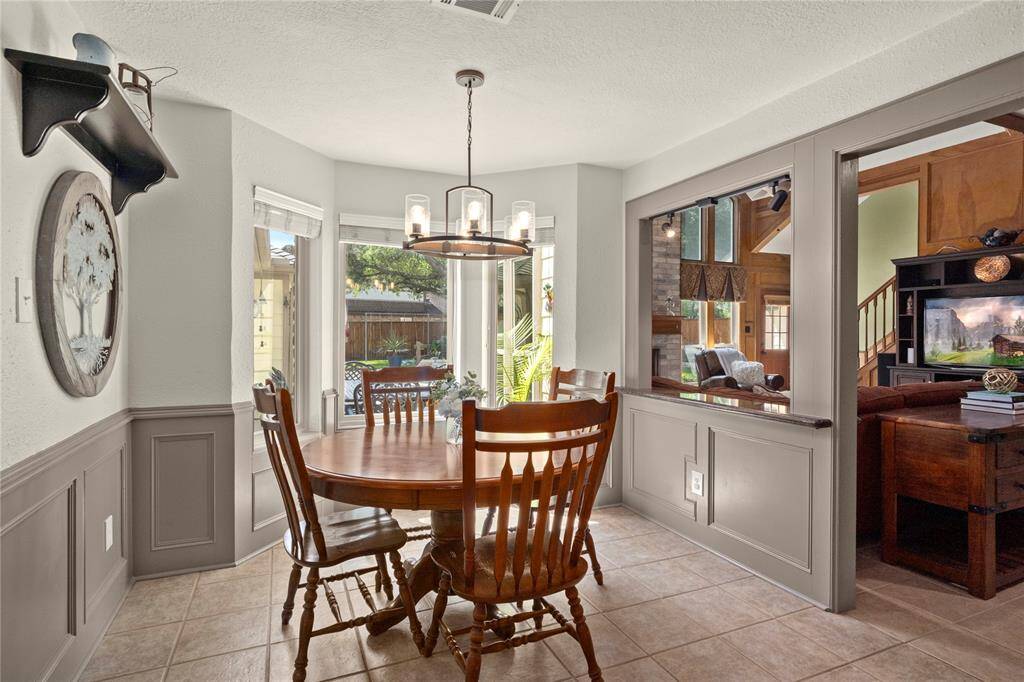 The breakfast area with its lovely bay window extension gives the owners a wonderful view of the pool as they sip on their first cup of coffee of the day.  What a serene setting to start the day!!