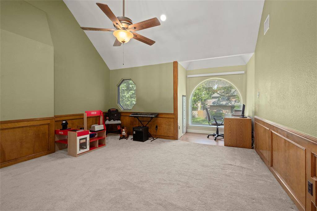 This massive 14’ x 20’ (with a 14’ ceiling) gameroom/playroom is the perfect spot for the whole family to learn to play, laugh and love each other.  There is a built-in space for a file cabinet to the left of the larger window.