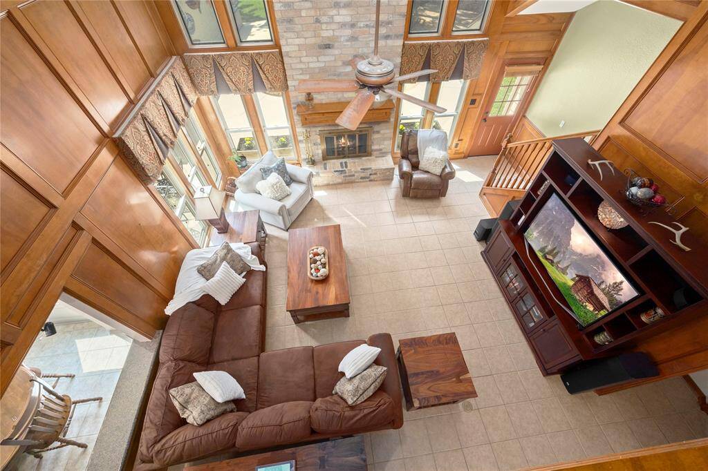 A view looking down from the balcony into the enormous family room.