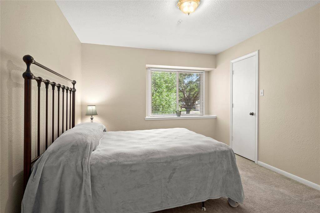 Another upstairs bedroom is very large with this sliding glass box window giving your guests an excellent view of the front yard.  This bedroom also has a sizeable walk-in closet.