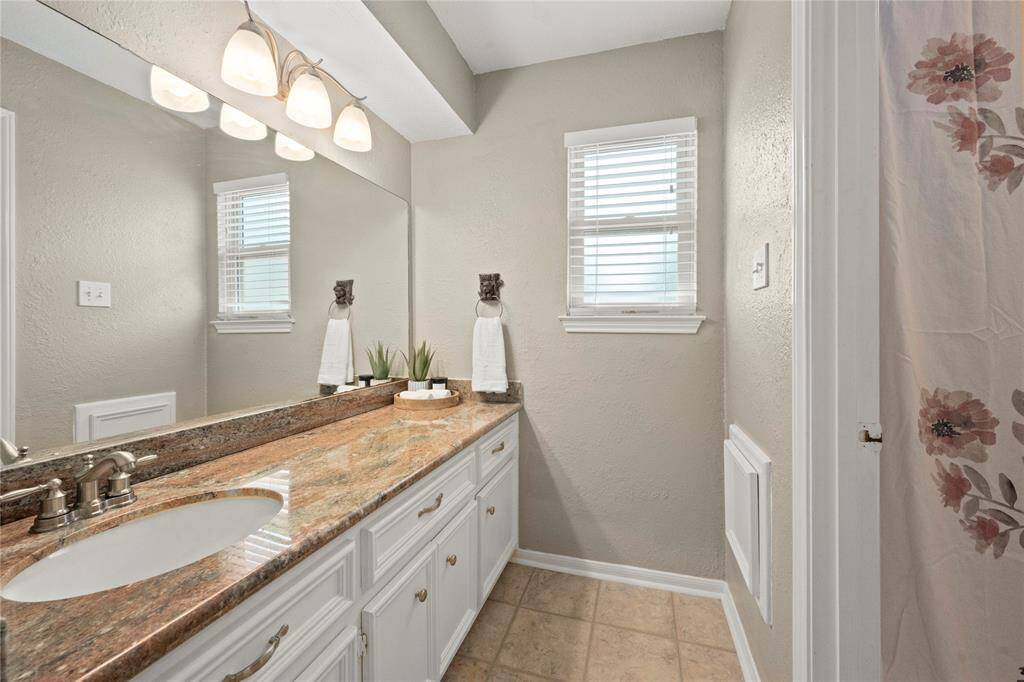 This is the other full bathroom upstairs.  It also offers a granite countertop, loads of storage, updated fixtures and this privacy window.