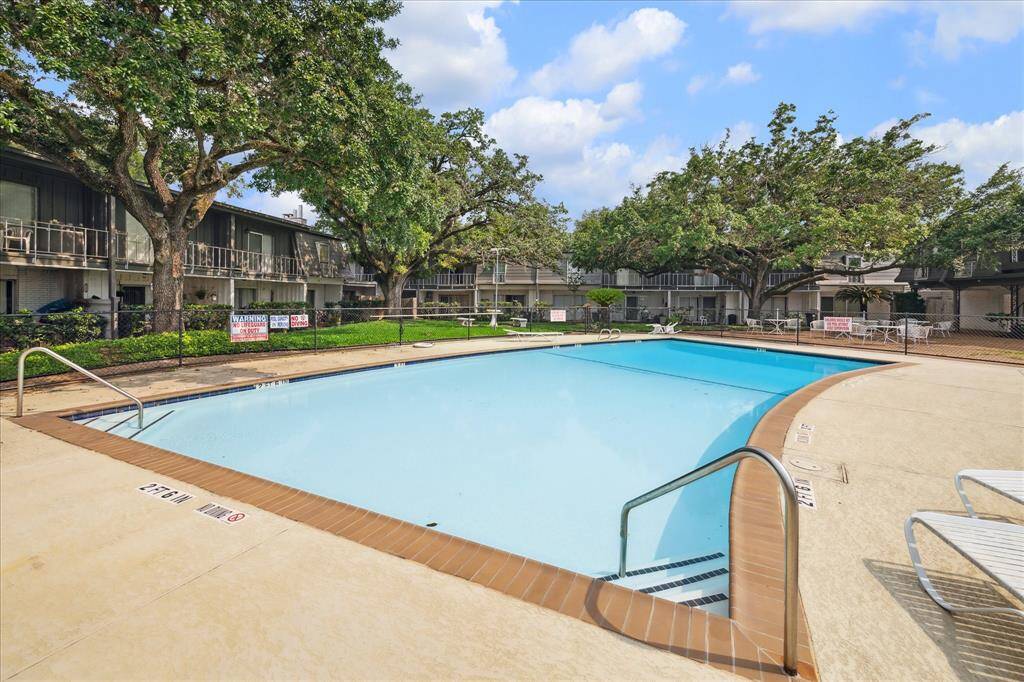 Enjoy a quiet, beautifully maintained community pool just steps from your condo.