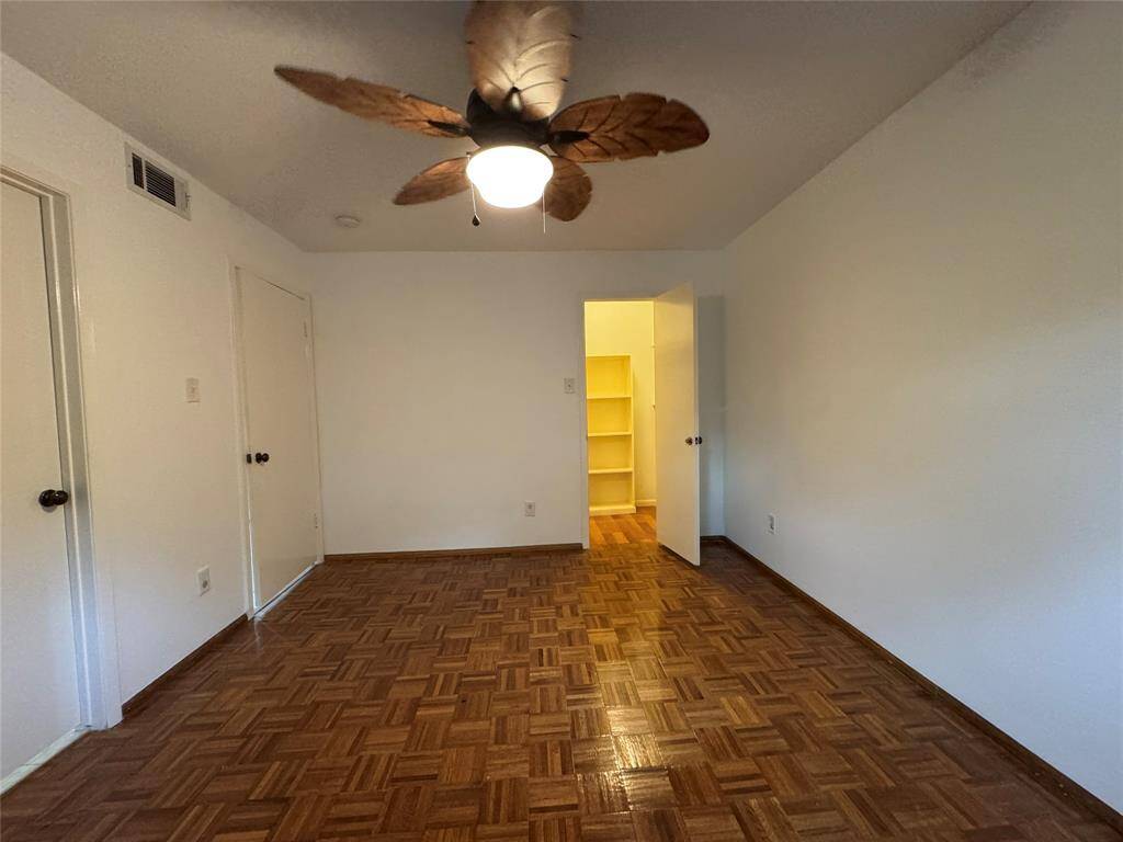 Downstairs Bedroom with wood floors and en-suite