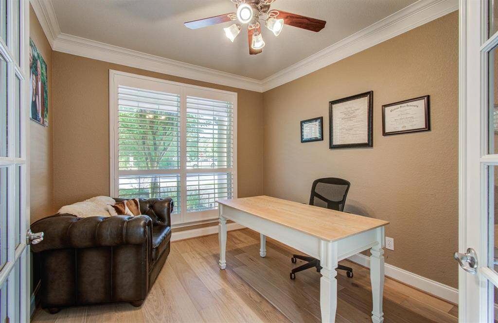 A private office with french doors just off the entry of the home.