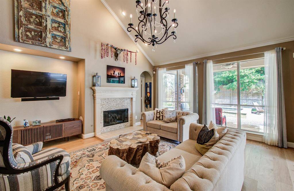 Vaulted ceilings, cozy gas fireplace and large windows with tons of natural light in the family room.
