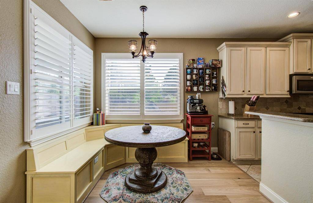 The breakfast area with build in storage in the benches and recent custom wood plantation shutters!
