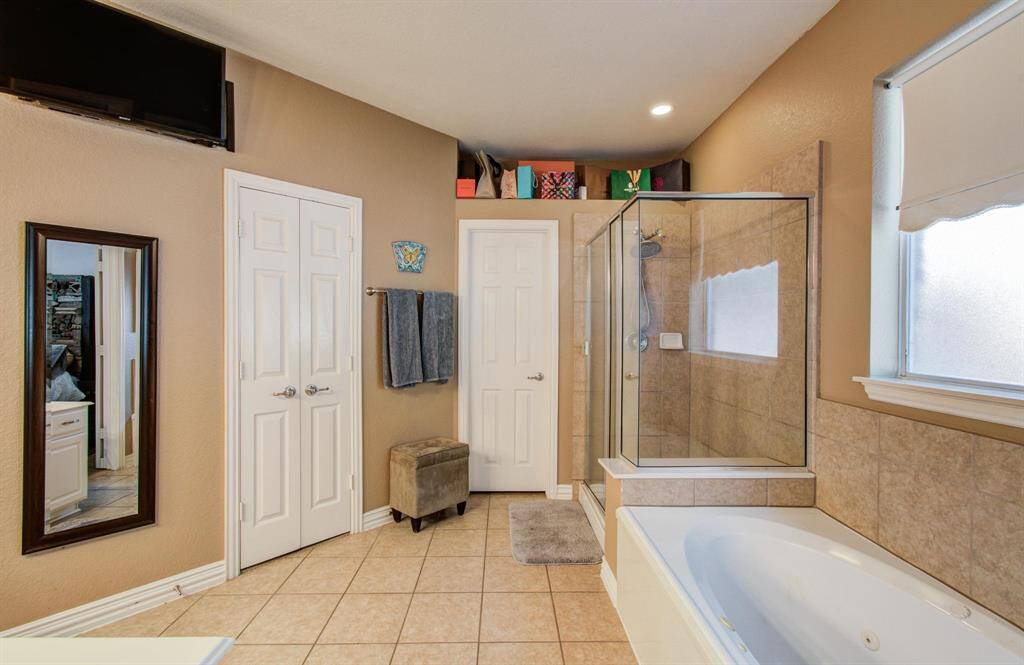 Primary bath with large jetted tub, separate walk in shower and so much. space!