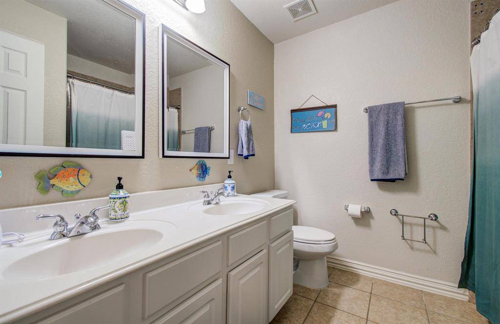 Double sinks and tub shower combo in one of two secondary bathrooms upstairs!