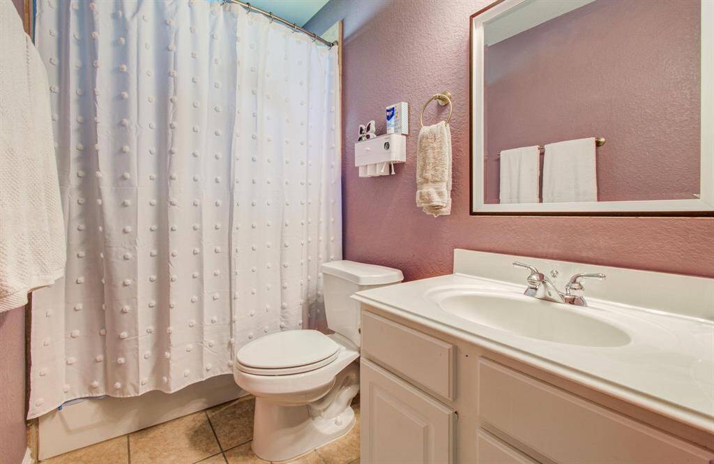 One of 2 secondary full bathrooms upstairs.