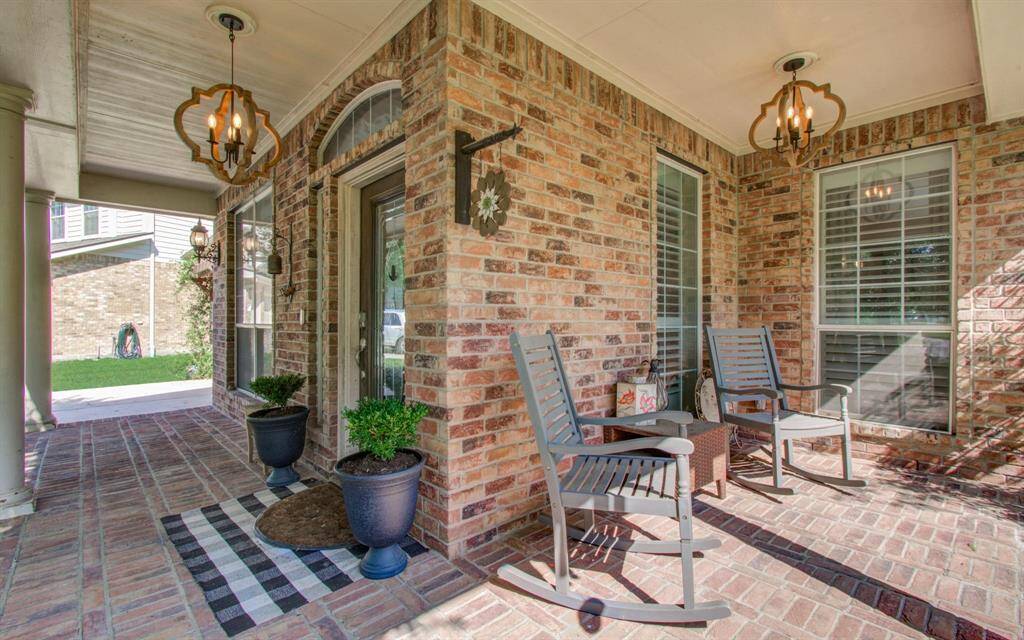 The porch wraps around for multiple neighborhood views.