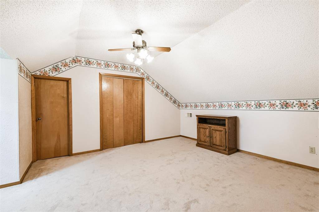 Large upstairs bedroom that could be used for a playroom, office, workout room, etc!
