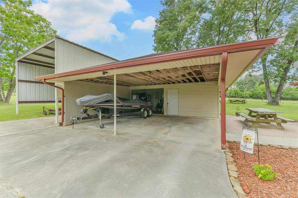 Carport big enough for two cars but also long enough to store your boat!