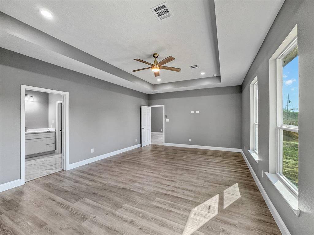 The primary suite is  super spacious. A great place to take a step away from the stress of any day!  Check out the  raised outlets perfect for your mounted flat screen TV.