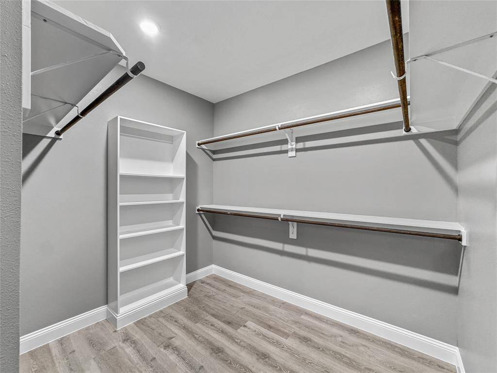 Check out this wrap around walk-in closet. Tons of storage space.