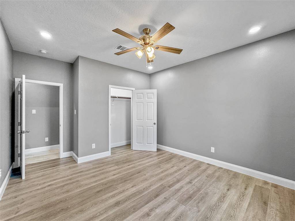 Third bedroom includes a ceiling fan and recessed lights and lots of natural light.