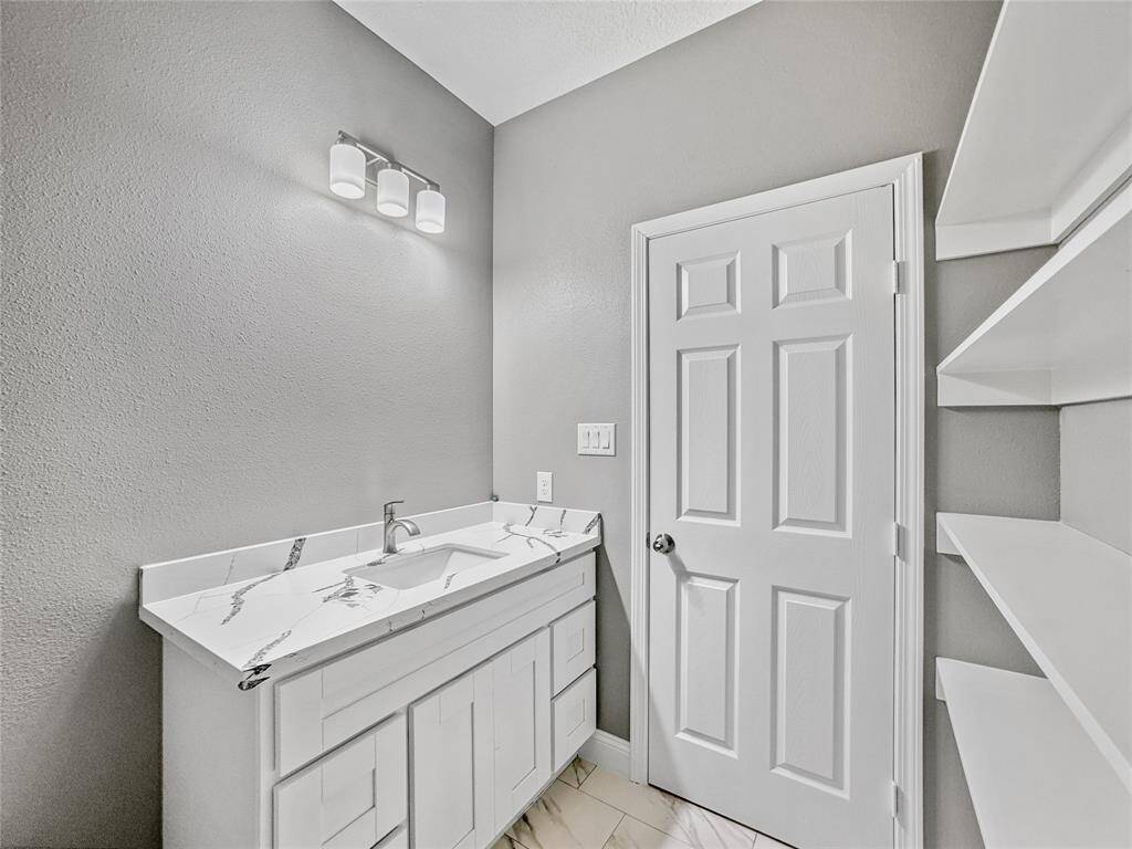 Quartz countertops throughout second full bath. No detail spared here.