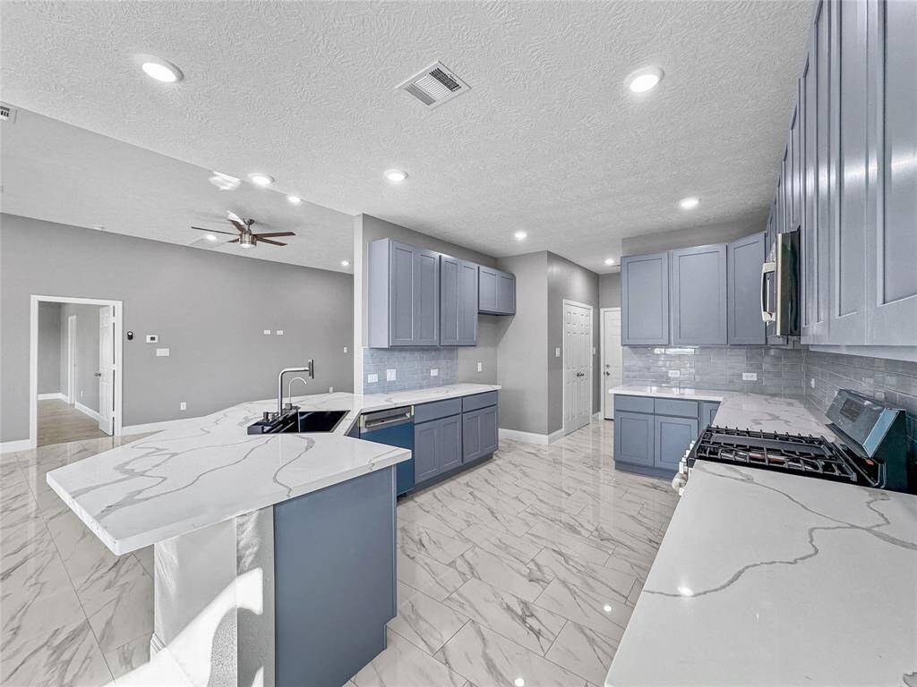 Stainless appliance included are Stove, Mounted microwave and dishwasher.