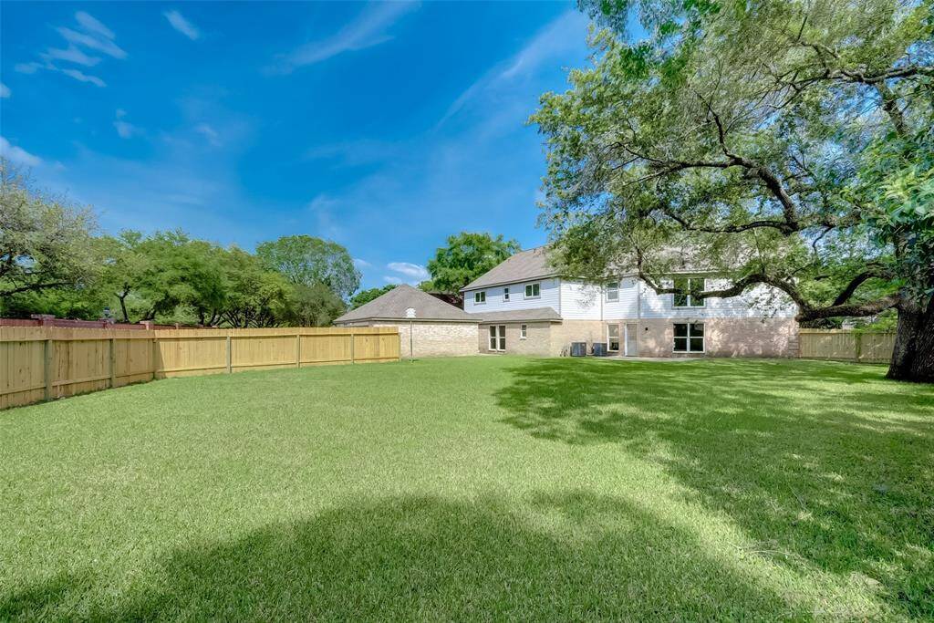 View of the gigantic backyard, big enough for anything you have in mind.
