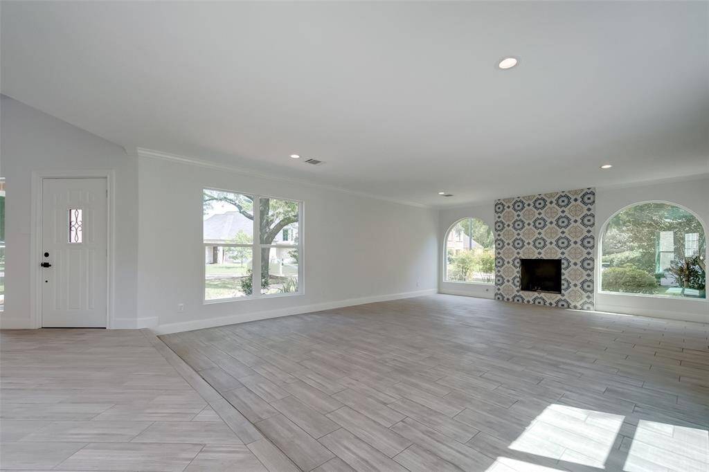Huge and bright living room with double panel windows (as throughout the house.)