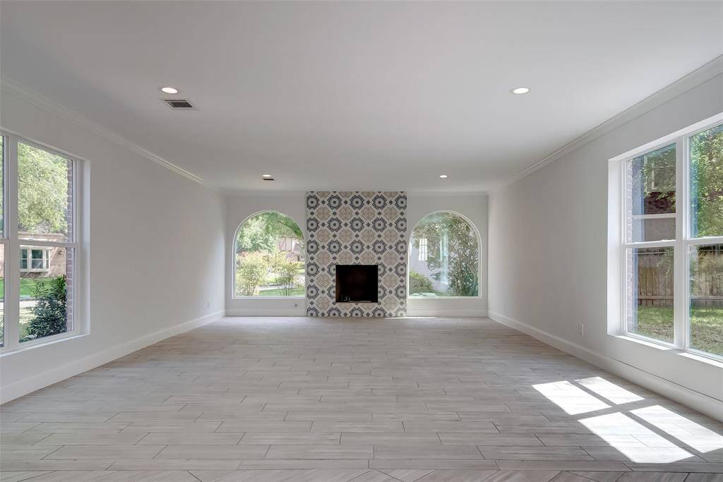 Another view of the living room and it's beautiful fireplace.