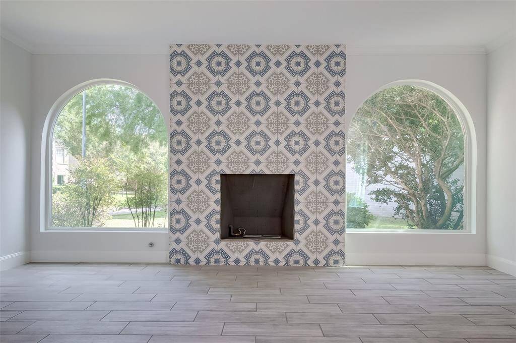 Closer view of the beautiful gas fireplace with mediterranean style fireplace.