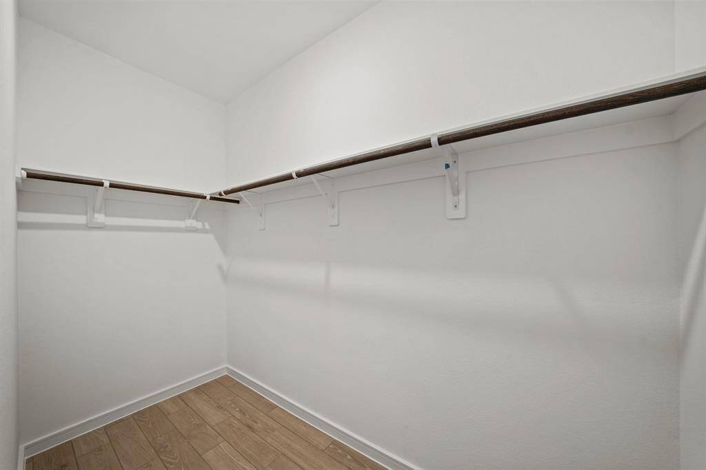 Walk-in closet in primary suite (*Photo not of actual home and used for illustration purposes only.)