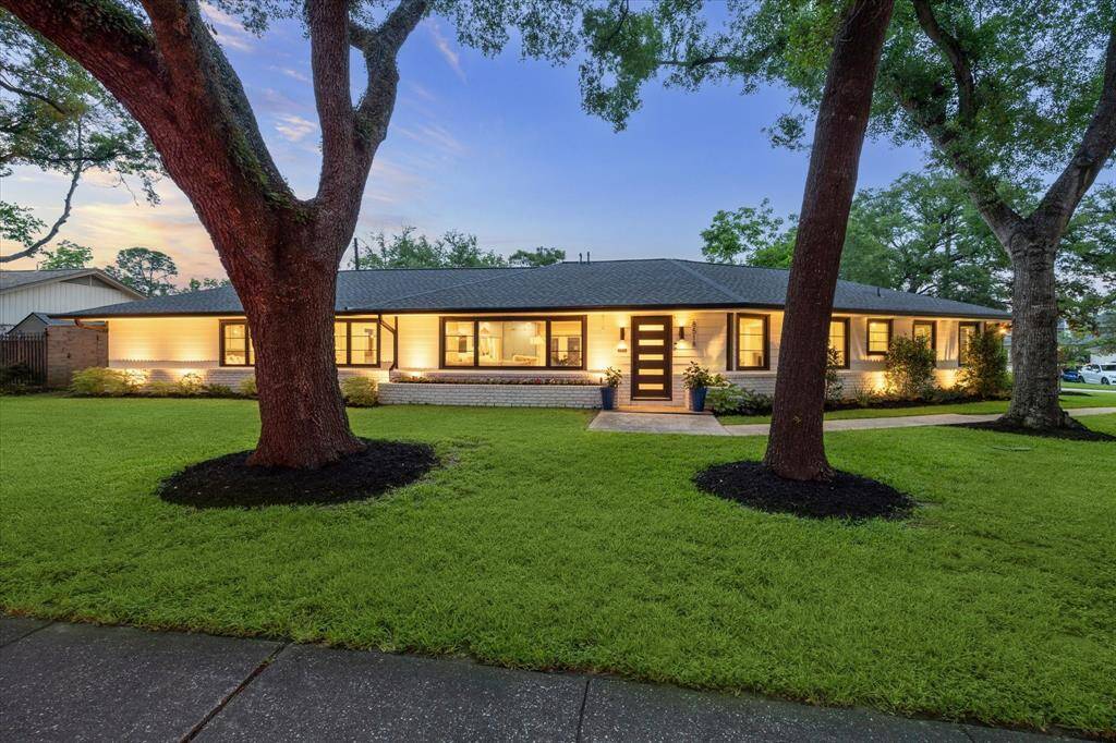 8518 Westview, a beautifully renovated ranch-style home boasting stunning curb appeal and mature trees on a spacious corner lot.