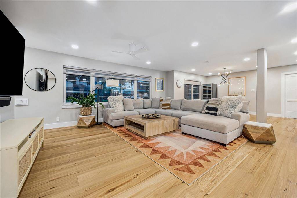 This home has so many thoughtful design features including custom shades on all the new windows, dimmers on all the lighting throughout, new doors and trim.