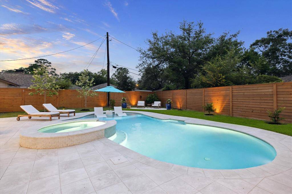 Amazing pool with spa and soaking deck with umbrella.  All completely redone w/ booster pump, heater, touch screen panel and app with remote access.